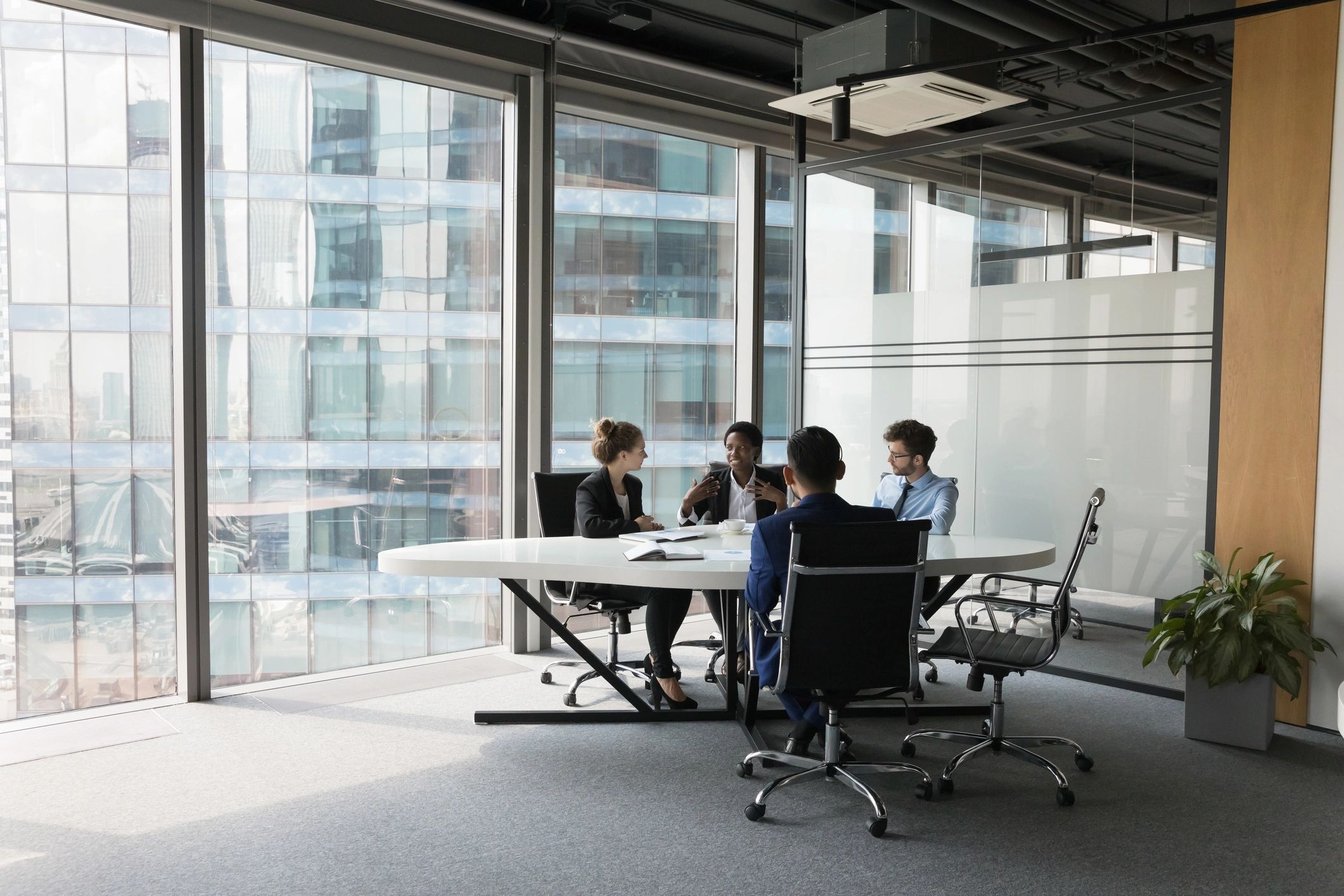 Diverse business team meeting around a conference table