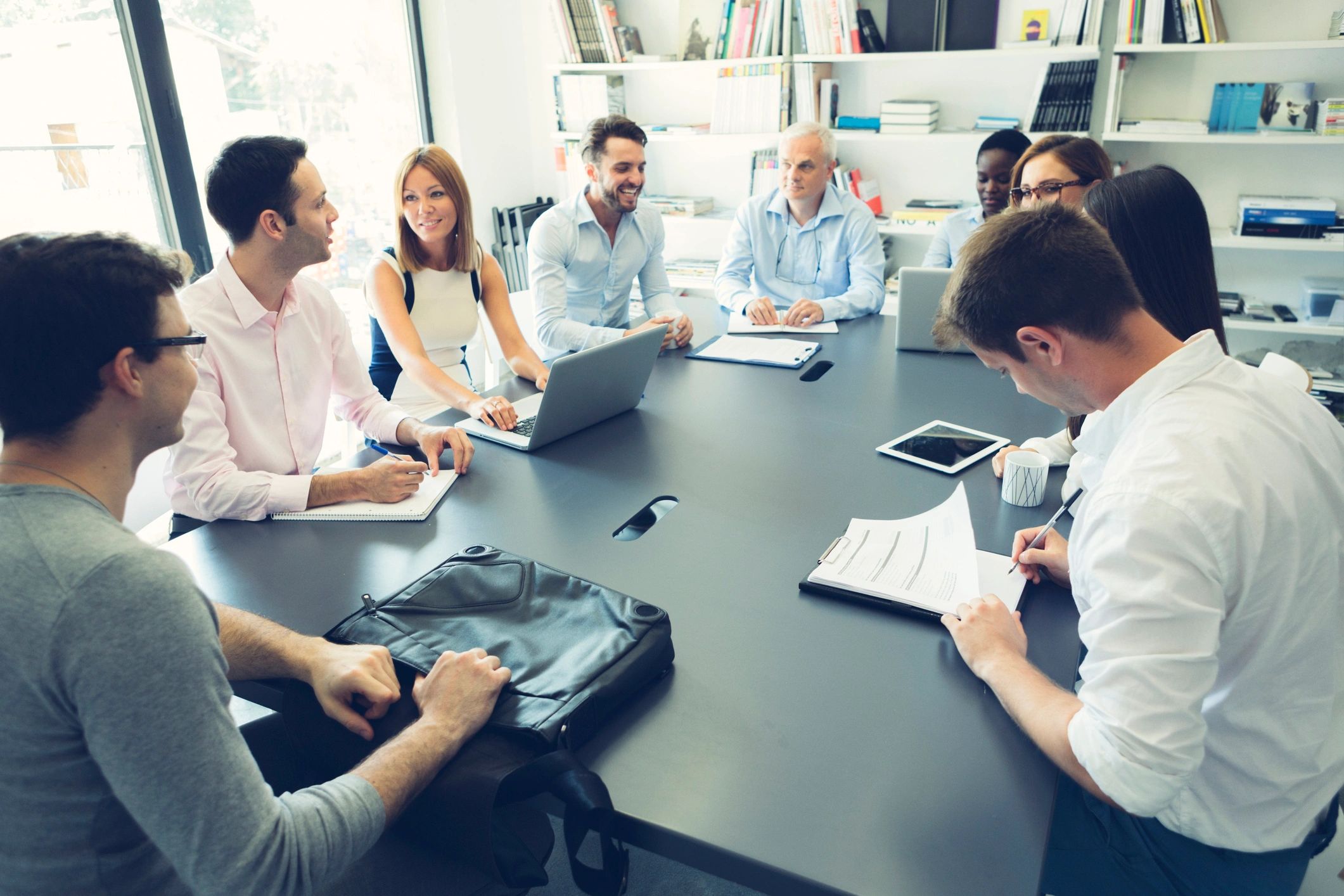 Consulting team meeting around a conference table
